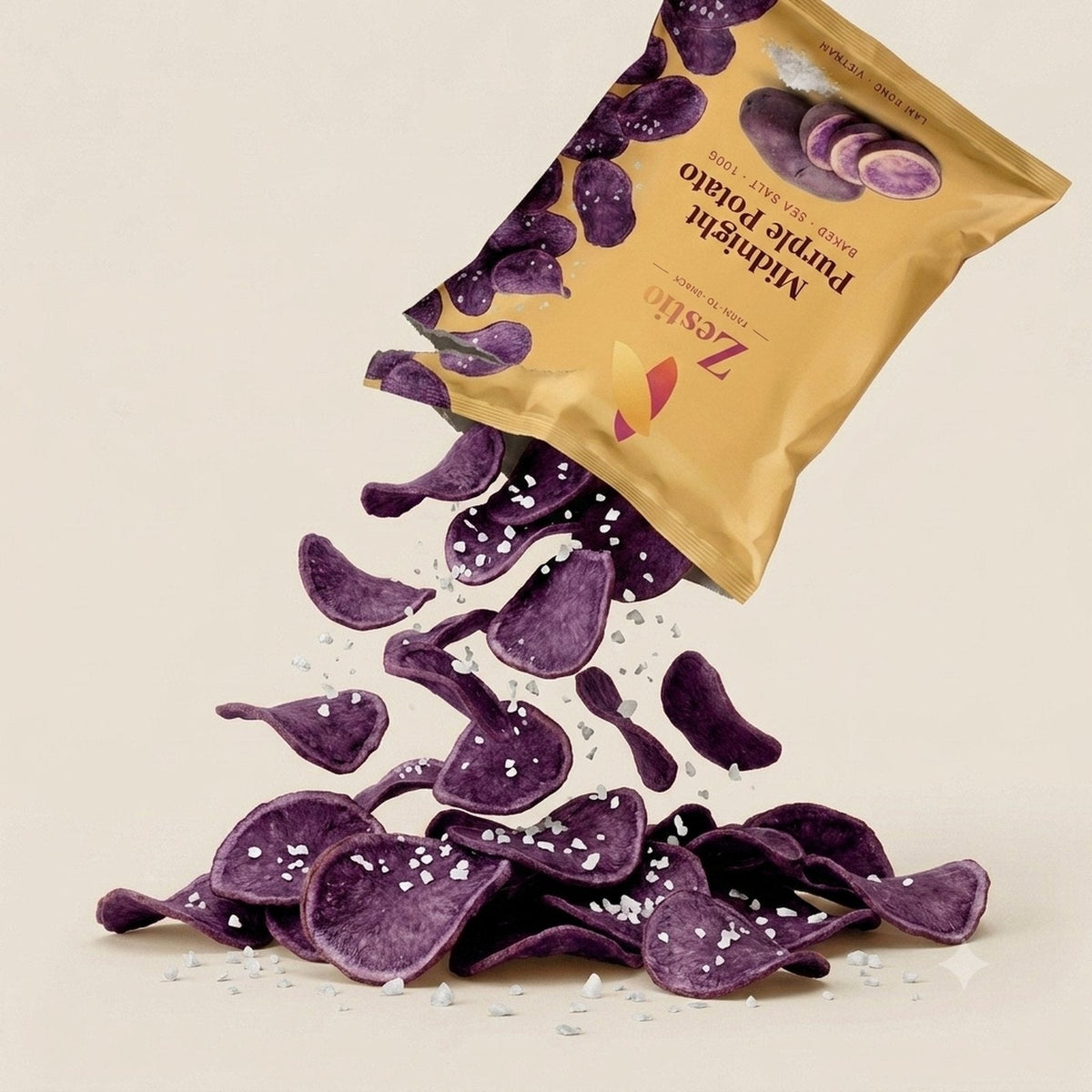 Midnight Purple Potato chips spilling from the pack with flaked sea salt